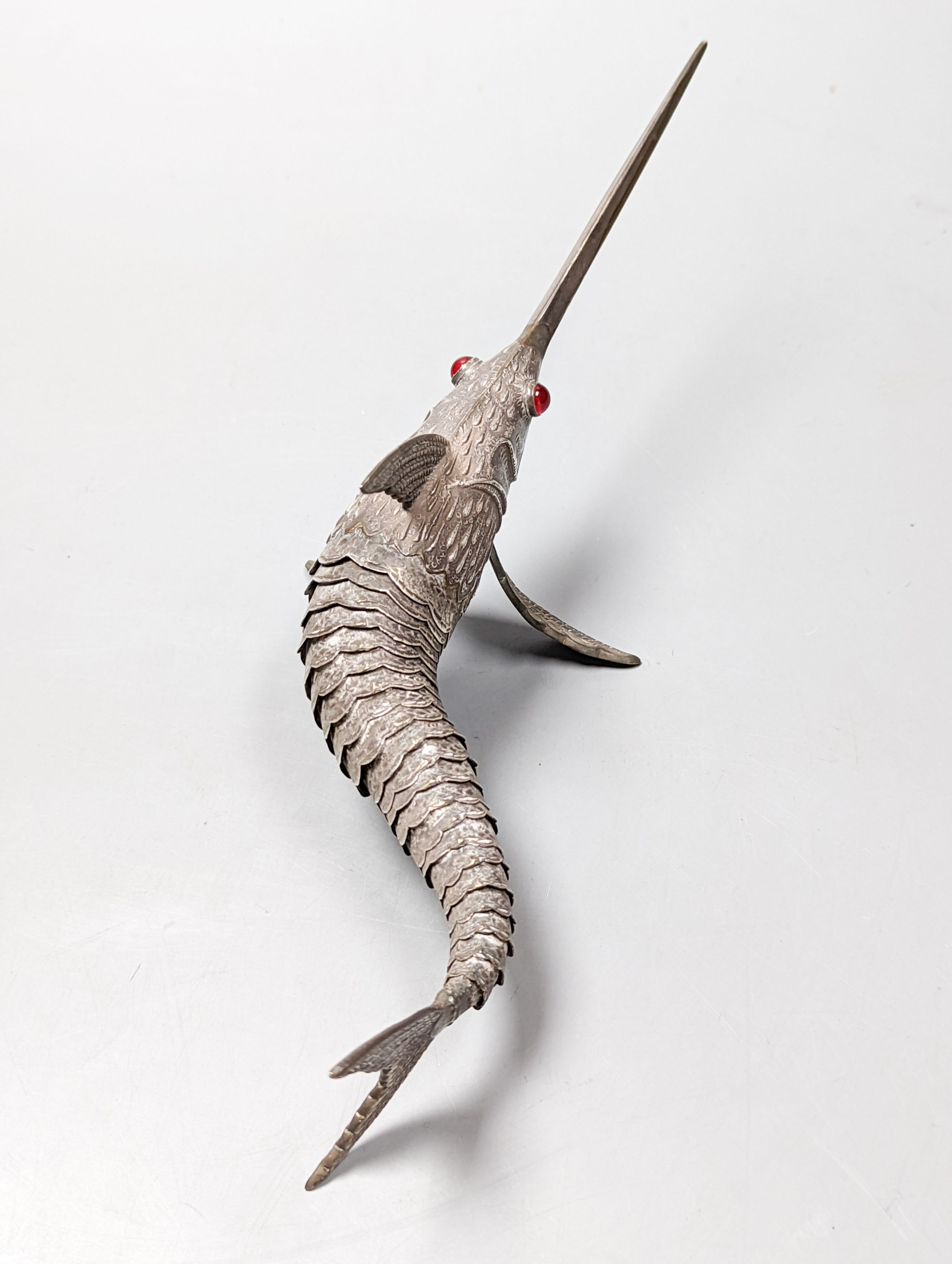A 20th century Spanish articulated model of a swordfish, with red glass eyes, approx. 26.5cm, gross weight 118 grams.